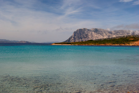 The sea of Capo Coda di Cavallo in San Teodoro, in the background the island of Tavolaraの写真素材