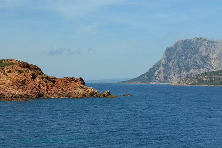 The coast of Capo Coda di Cavallo in San Teodoro, in the background the island of Tavolaraの写真素材
