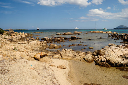 The bay of Petra Ruja in Costa Smerlda full of boatsの写真素材