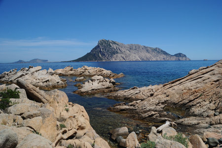 The coast of Punta Molara, with Tavolara Island in the backgroundの写真素材