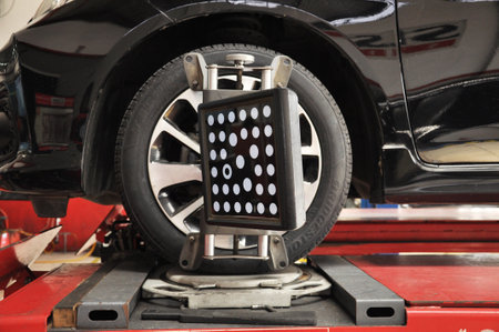 Target of the car wheel angle adjustment equipment fixed on a car wheelのeditorial素材