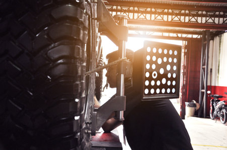 Target of the car wheel angle adjustment equipment fixed on a car wheelのeditorial素材