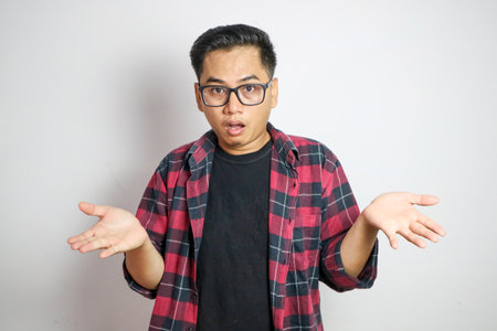 Asian man casual shirt feels tired and confused about working isolated