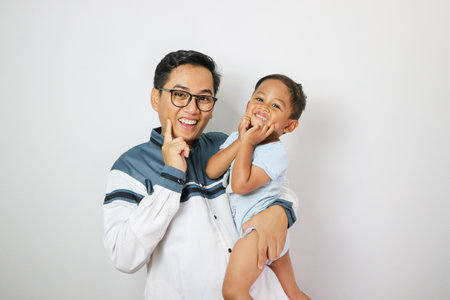 Portrait of dad and children isolated on white backgroundの写真素材