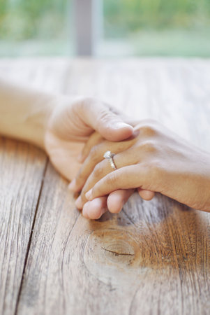 Couple holding hands on a date close upの写真素材