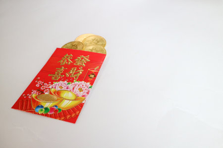 Crypto currency coins on top of traditional red envelope gift packets