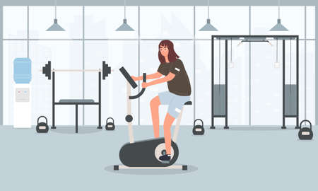 Young fit pretty girl training on an exercise bikeのイラスト素材