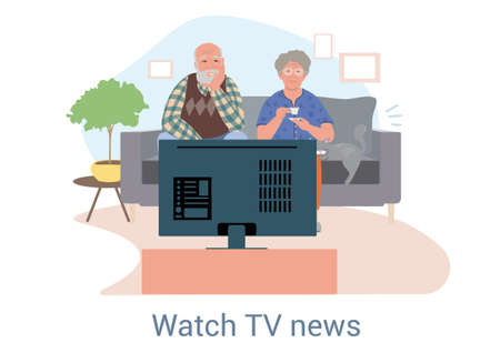 Elderly couple sitting watching the news on television