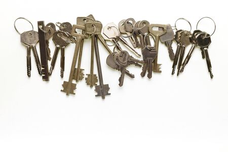 a lot of different keys on a yellow backgroundの写真素材