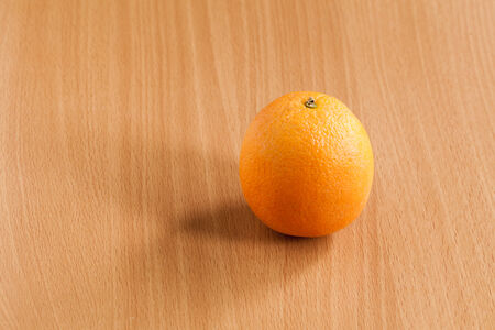 Fresh oranges on wooden table.の写真素材