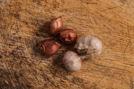 fresh Onions and garlic on a wooden background.の写真素材
