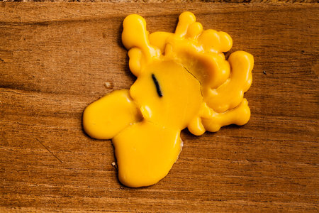 candle dripping on wood の写真素材