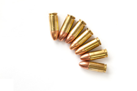 9mm bullet for a gun isolated on white background.の写真素材