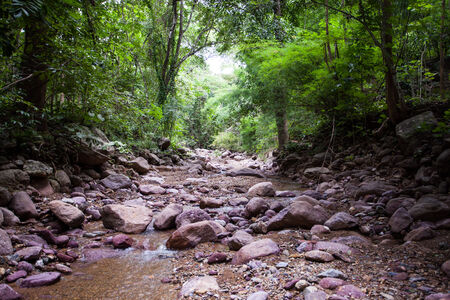 Long exposure shot of a river and rocks.