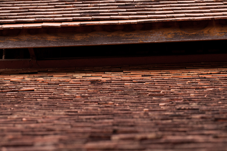 Old rasian wooden roof texture tiles made of terracotta background.