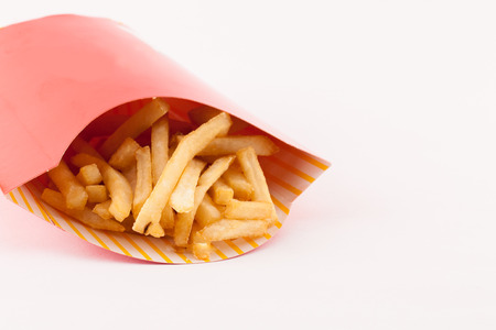 French fries chips on isolated white background.