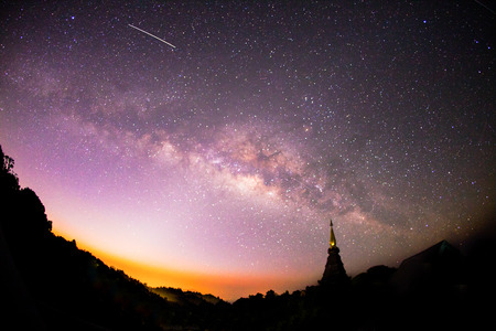 The Milky Way rises over the silhouettes pagoda in Thailand. Shot taken fisheye wide angle lens, Long exposure photograph.の写真素材