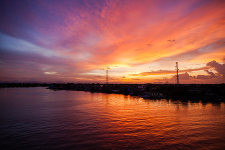 Silhouetted the beach at the sunset time.の写真素材