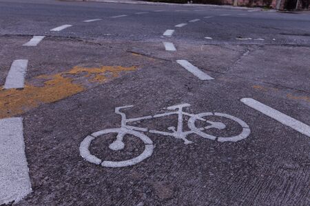 Bicycle road sign paint on the pavement.の写真素材