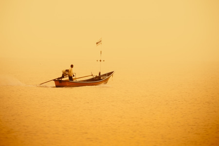 A traditional cormorant Traditional thai long tail boat at the Fishing Village on Songkhla, Thailand.のeditorial素材