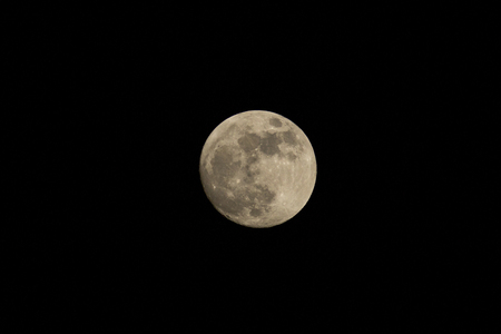 Full moon over sky at night.の写真素材