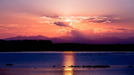Scenic view of beautiful sunset over lake.の写真素材