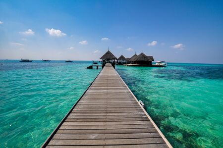 Beautiful beach with water bungalows at Maldives.の写真素材