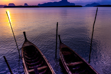 Traditional thai boats at sunrise beach.の写真素材