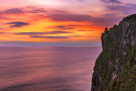 View of Sunset at Uluwatu cliff in Bali, Indonesiaの写真素材