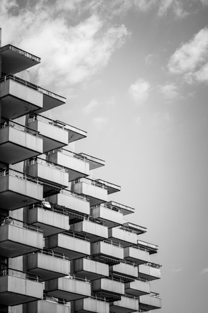 Black and white image of a facade with many balconiesの写真素材