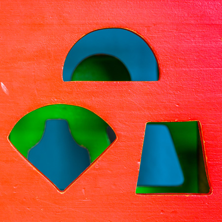 Front side of a colorful wooden toy cube