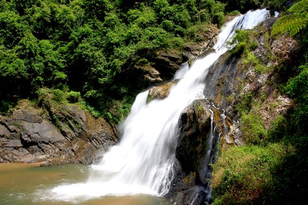 Large central waterfall dry evergreen forest in southern Thailandの写真素材
