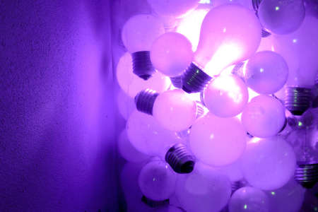 bright bulb in crowdの写真素材