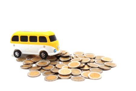van over a lot of golden coins (isolated on white)の写真素材