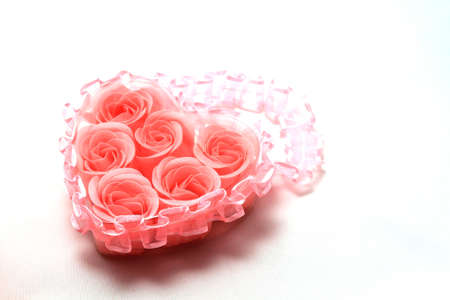 Heart of   pink roses isolated over whiteの写真素材