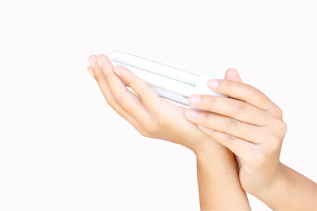 hand holds the lamp electrical economical whiteの写真素材