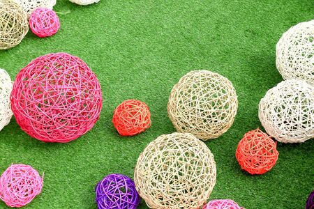color rattan ball on green grass.の写真素材
