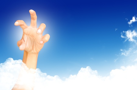 abstract concept hand towards skyの写真素材