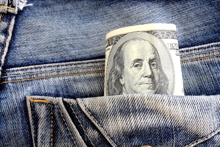 dollars in a jeans pocket, closeup