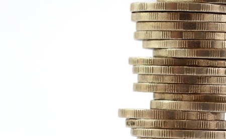 Coin stack, close-up on white background  (Select Focus)