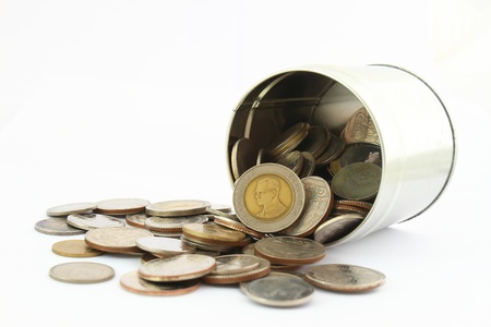 coins in a tin can . Isolated over white .の写真素材