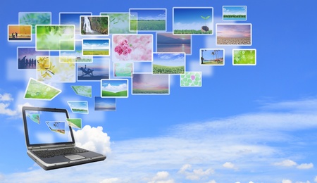 Multimedia concept with modern laptop on green field.の写真素材