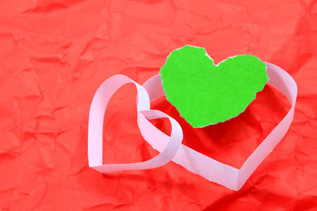 Paper hearts on red backgroundの写真素材