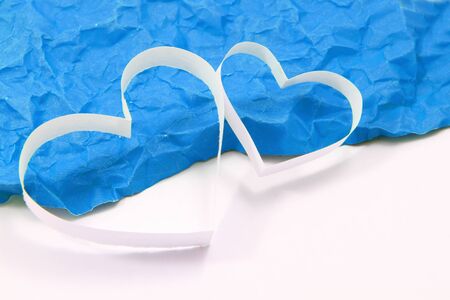 Paper hearts on blue backgroundの写真素材