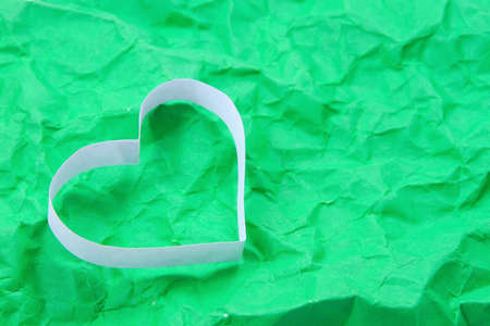 Paper hearts on green backgroundの写真素材