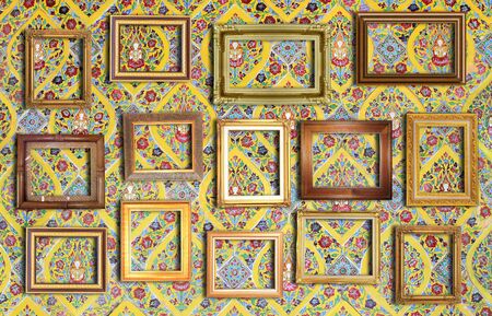golden frame on  gold  wallの写真素材