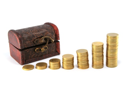 A wooden ancient chest full of moneyの写真素材