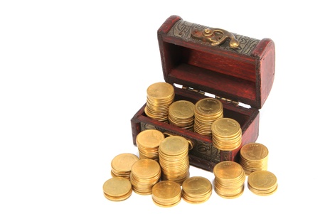 A wooden ancient chest full of moneyの写真素材