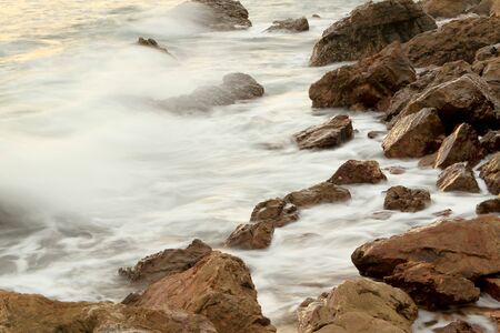 Beautiful seascape. Sea and rock at the sunset