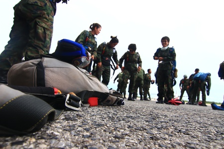 Sattaheep - SEPTEPBER 12: Thai navy parachute team prepare for jump for show in Sunset parade on Sep. 12, 2012 in Sattaheep, Chonburi, Thailandのeditorial素材